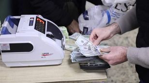 ما التحديات التي تواجه زيادة الاعتماد على العملة المحلية بين العراق وتركيا؟