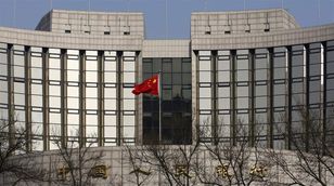 ألفين تان: الصين تجري عملية اندماج في قطاع البنوك للسيطرة على المديونية 